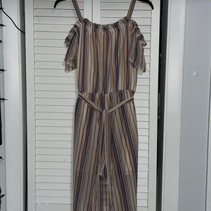 Colorful striped jumpsuit with a built in cape around the waist. Size medium.